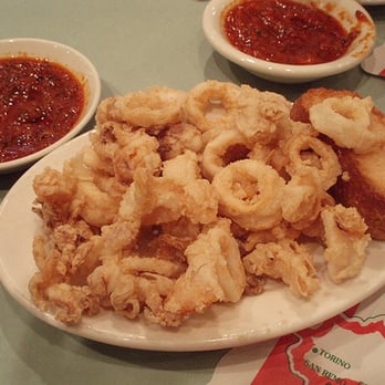 Randazzo's Clam Bar signature dishes Spaghetti with Red Clam SauceFried CalamariRaw Clams and Oysters